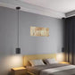 2-pack modern dimmable LED pendant cylinder lights hanging in a bedroom, suitable for damp locations, featuring black matte finish and adjustable hanging height