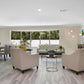 Modern living room interior illuminated with ultra slim LED recessed ceiling downlights, showcasing elegant décor, soft ambient lighting, and contemporary residential design.