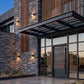 Commercial LED wall pack lights installed on an office building exterior for outdoor security lighting and nighttime visibility.