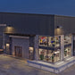 LED wall pack lights illuminating a manufacturing factory exterior, loading area, and surrounding work spaces