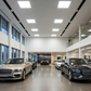 LED Back-Lit Panel Light installed in car dealership showroom, delivering clear, energy-efficient illumination for display vehicles