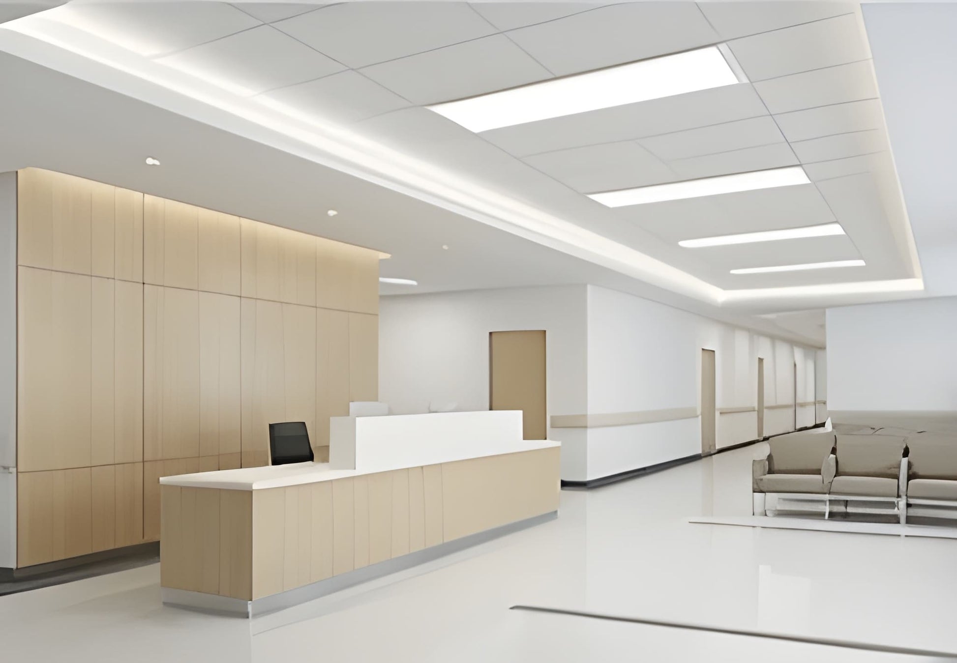 LED Back-Lit Panel Light PB2 Series installed above an office building front desk area, providing bright, glare-free, energy-efficient illumination for commercial spaces