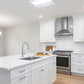 Modern kitchen illuminated with LED Center Basket Troffer ceiling lights delivering even, clear, energy-efficient lighting