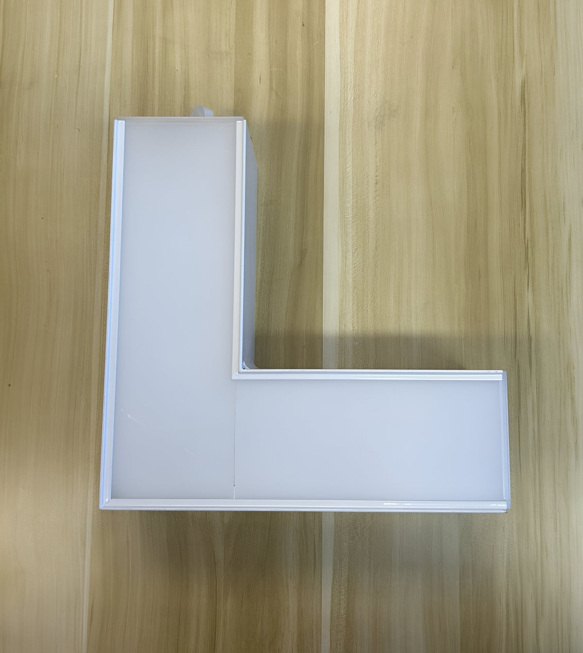 L-shaped connector for linking LED linear lights into custom layouts