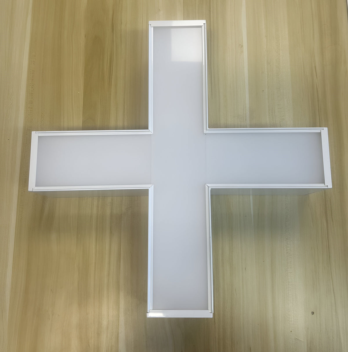 X-shaped connector for linking LED linear lights into custom layouts