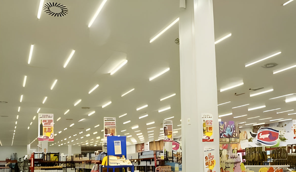 LED linear strip light fixtures providing bright, uniform lighting in a supermarket