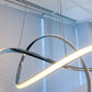Close-up of modern LED swirl chandelier illuminated with smooth, even LED light