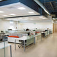 Modern office ceiling featuring LED surface mount backlit panel lights with elegant glare-free illumination and energy-efficient performance
