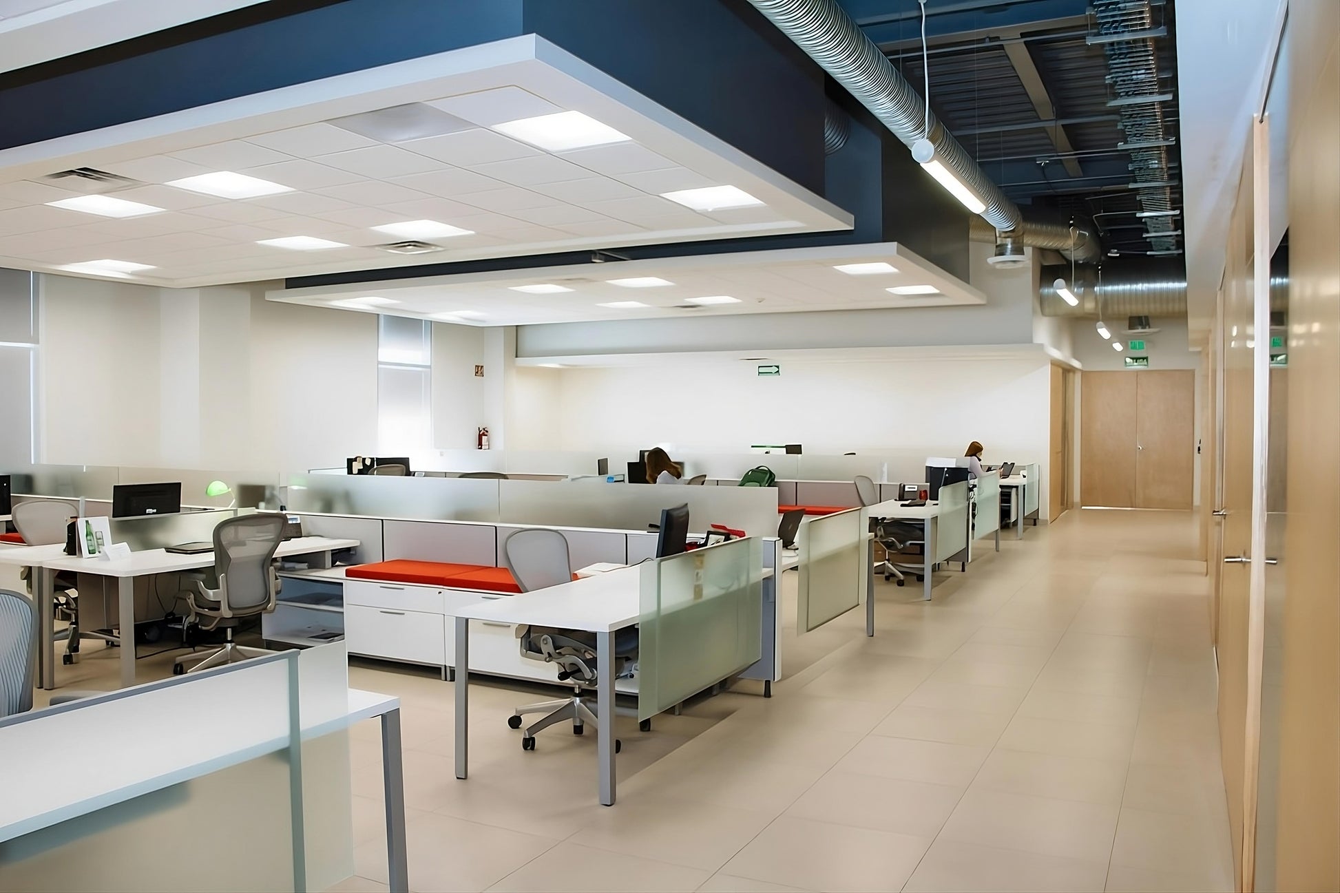 Modern office ceiling featuring LED surface mount backlit panel lights with elegant glare-free illumination and energy-efficient performance